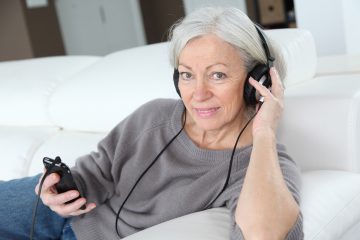 Senior woman listening to music with headphones